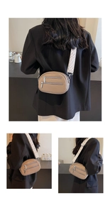 Detail der khakifarbenen Brusttasche mit Kieselleder-Struktur und Jacquard-Gurt