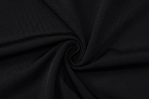 Macro shot of black fabric texture with detailed weave for a sexy backless dress