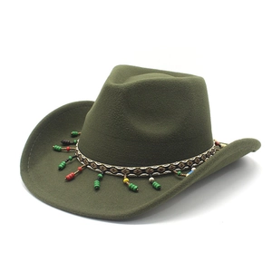Detail of olive green wool cowboy hat featuring ethnic woven band and colorful beads