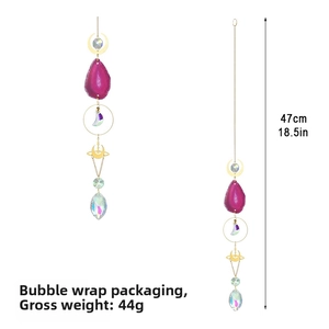 Detail of crystal sun catcher with purple agate slice and moon charm showing 47cm length