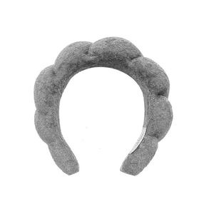 Close-up of grey puffy cloud sponge headband with soft plush texture and interior label