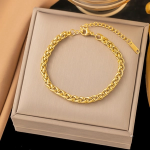 Detail of adjustable 18k gold plated wheat chain bracelet with lobster clasp and tag