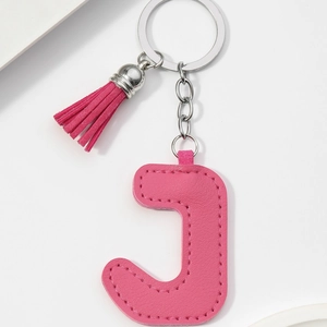 Pink PU leather letter J keychain with matching tassel and gold-tone metal ring