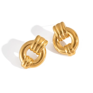 Detailed close-up of golden thick knot hoop earrings with high-gloss polished metallic finish