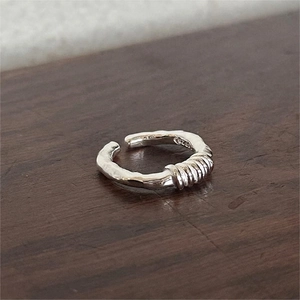 Minimalist S925 sterling silver twist ring featuring vintage lava texture and open band style