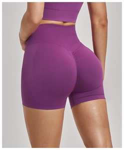 Detail of high-waisted purple yoga shorts featuring seamless knit and scrunch butt design