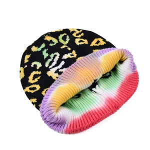 Leopard print knitted beanie featuring colorful tie-dye lining and warm autumn winter style