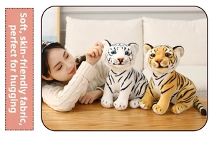 Close-up of realistic plush tiger toys showing soft fabric texture and detailed facial features