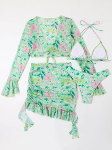 Detail of four-piece floral mesh swimsuit including long sleeve cover-up and ruffled skirt