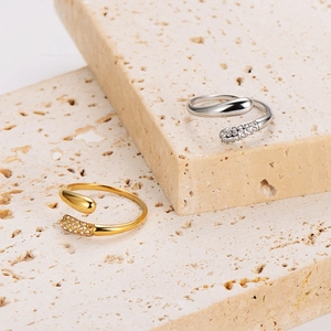 Minimalist stainless steel hug ring with sparkling rhinestones in gold and silver finish