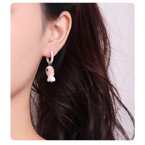 Handmade gradient pink fish glass stud earrings on female model for summer style