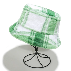 Detail of green and white checkered plush bucket hat showing soft faux fur texture