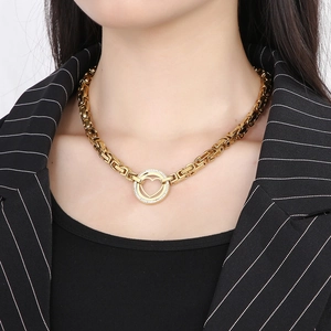 Detail of gold-plated Byzantine chain necklace with hollow heart circular pendant