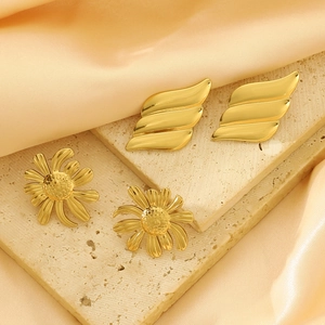 Golden stainless steel earring set featuring daisy flowers and geometric leaf shapes