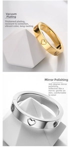 Macro view of gold and silver heart rings with 18K plating and inlaid crystals