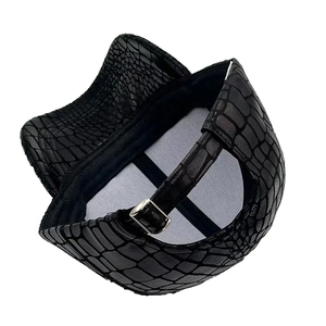 Detail view of black faux crocodile texture baseball cap with adjustable metal buckle