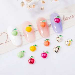 Colorful alloy peach 3D nail art charms in various glossy finishes for DIY manicure