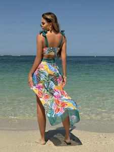 Three-piece floral print swimwear set with bikini and mesh beach maxi skirt for women