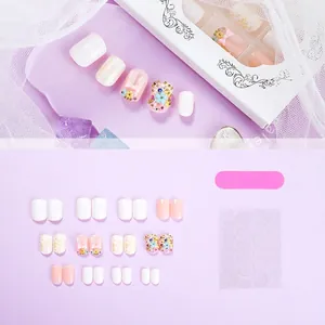 3D floral press-on nails with cute bunny and bow accents for a fresh summer look