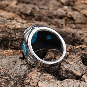 Vintage silver stainless steel ring for men featuring a blue turquoise stone on tree bark