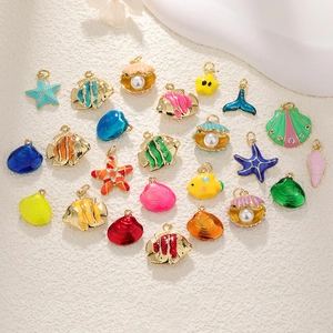 Golden ocean theme charms with colorful enamel shells and sea stars for DIY jewelry