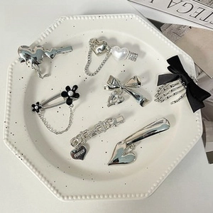 Detailed macro view of 7-piece Y2K style silver alloy butterfly and heart hair clips