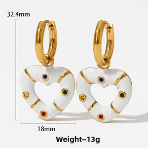 Detailed macro view showing the size and weight of colorful heart drop earrings