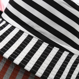 Close-up of graffiti bucket hat showing reinforced stitching and striped fabric texture