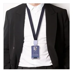 Business ID badge holder in light purple leather with black neck lanyard worn on suit