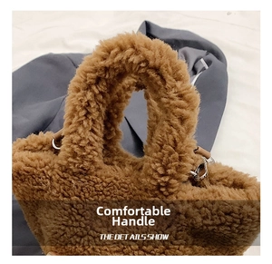 Detail showing plush bucket bag handle and silver metal buckle attachment point