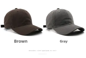 Detail view of brown and grey washed cotton baseball caps with vintage twill texture