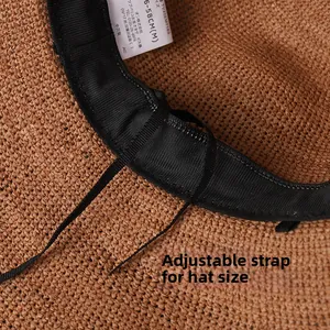 Detail view of woven raffia sun hat interior with sweatband and adjustable string