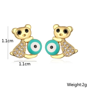 Detail of 18K gold plated bear earrings with sparkling crystals and evil eye charm