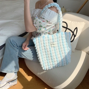 Detail of blue and white checkered bubble texture tote bag with LOVE SOZAKK label