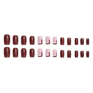 Christmas press-on nails set in deep red and pink with festive Santa hat glitter designs