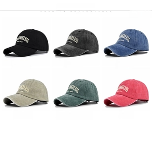 Multiple colors of LOS ANGELESS embroidered baseball caps in washed denim style