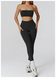 Detail of a seamless black high-stretch sports set with strapless top and leggings