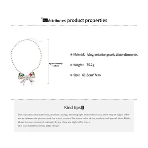 Detail view of large bow pendant necklace with colorful rhinestones and faux pearls