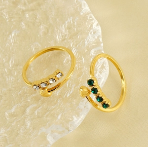 Detailed view of adjustable 18K gold plated rings with heart charms and sparkling zircons