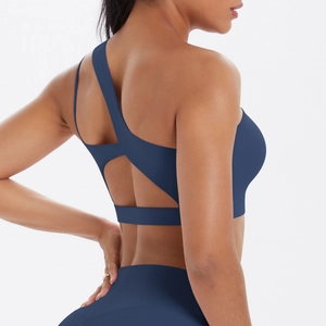 Detail of navy blue one-shoulder sports bra with breathable hollow back design