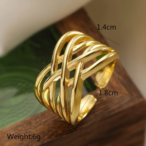 Macro view of gold woven irregular open ring with dimensions 1.4cm wide and 1.8cm diameter