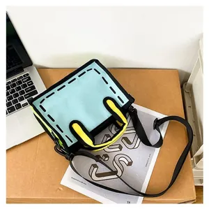Macro shot of 2D cartoon style canvas bag showing bold black outlines and blue fabric