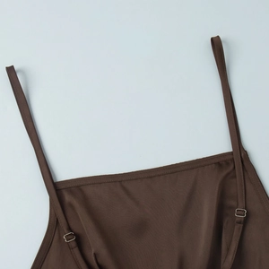 Detail of satin camisole showing adjustable double shoulder straps and metallic buckles