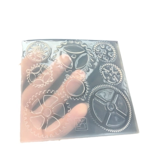 Square clear silicone mold with nine diverse gear shapes for steampunk resin crafts