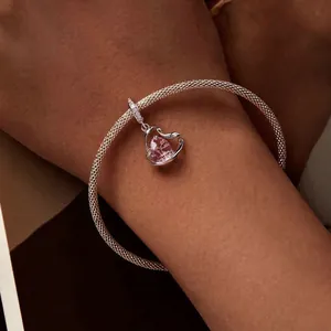 Pink heart pendant on silver mesh bracelet shown on wrist for Thanksgiving jewelry gift