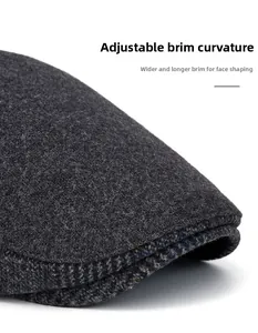 Detail of wool newsboy cap showing the bendable brim and widened design for face shaping