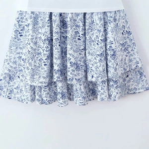 French style floral V-neck dress featuring layered ruffle hem and puff sleeves in blue print