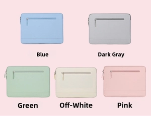 Flat lay of laptop sleeve collection in blue, dark grey, green, off-white and pink colors
