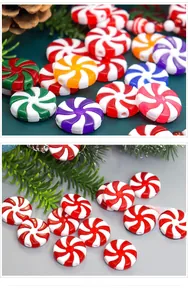 Macro detail of peppermint swirl candy ornaments with red and white festive patterns