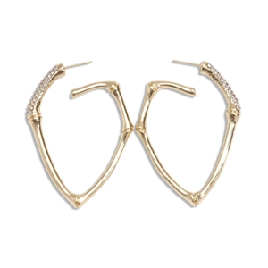 Golden heart-shaped bamboo texture earrings with sparkling diamond accents on white background